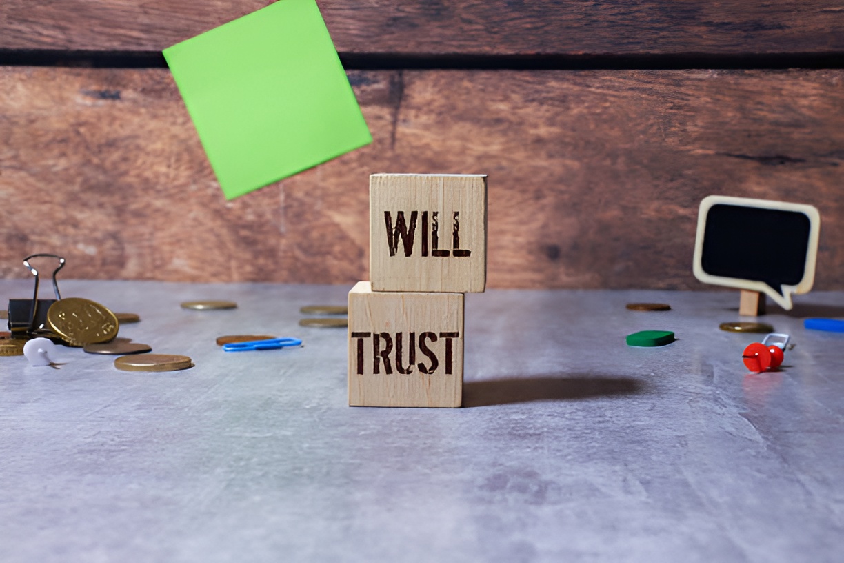 'will' and 'trust' written on wooden blocks